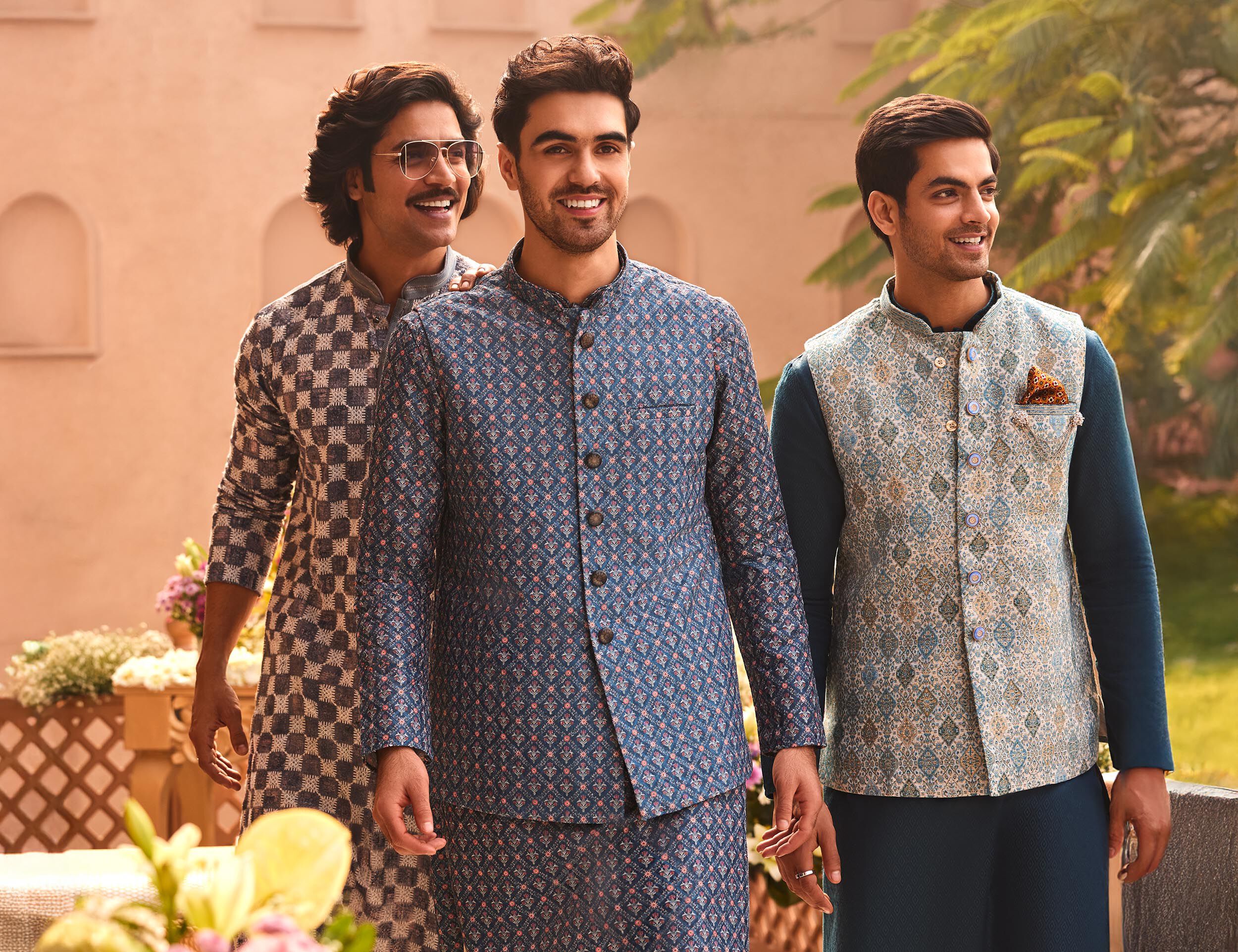 Men flautning their kurta jacket set for wedding reception